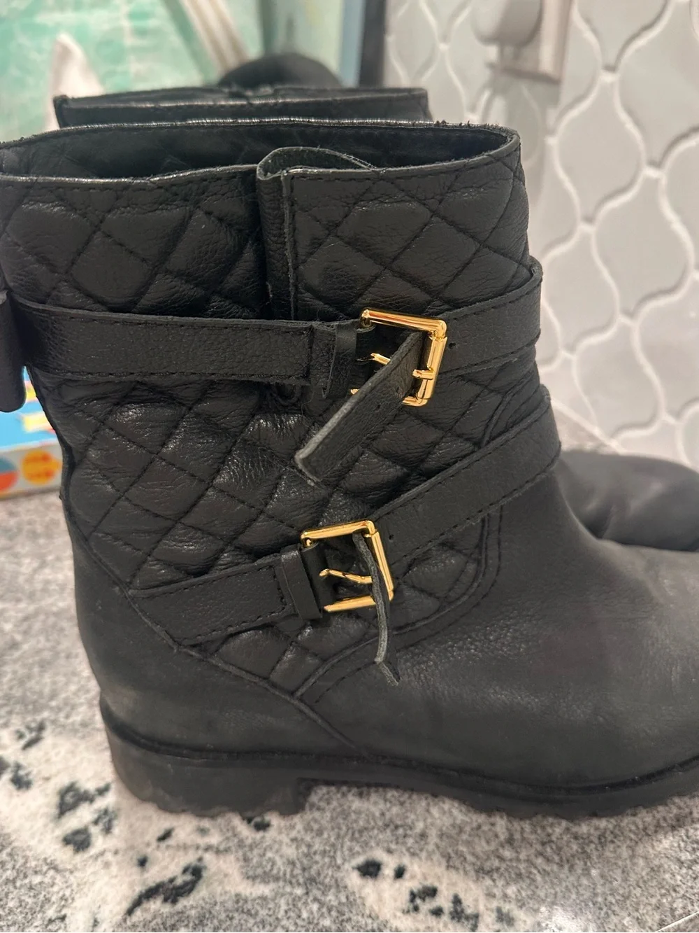 kate spade Black Quilted Leather Ankle Booties with Bow and Gold Spade Hardware
